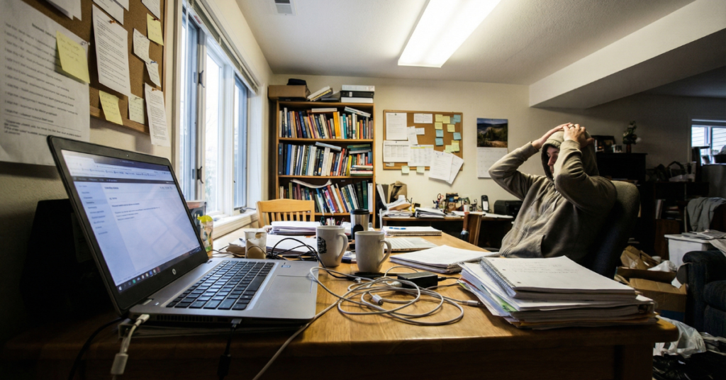 Small desk in a cramped workspace leading to poor focus and mental fatigue
